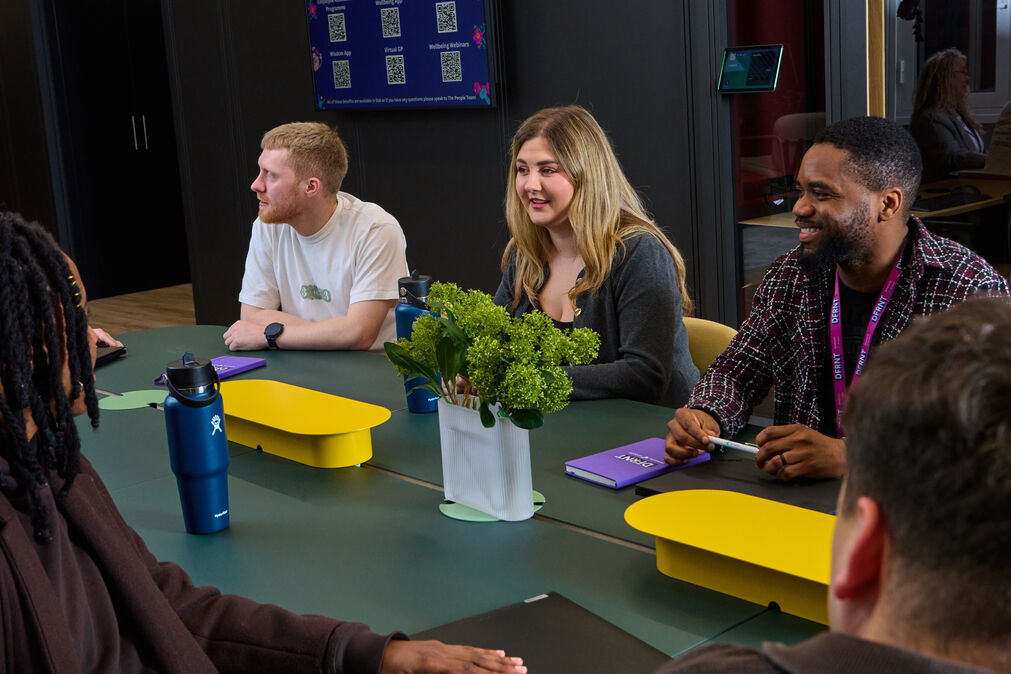 DFC Staff in a meeting, discussing ideas